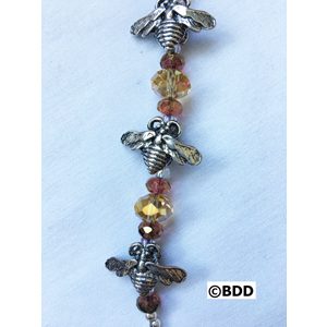 A bracelet with bee charms and beads.