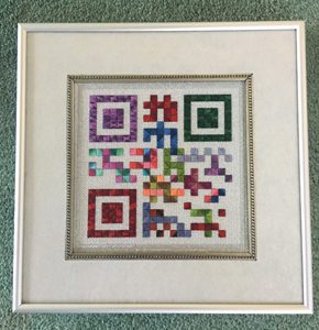 A picture of some colorful squares in a frame.