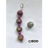 A pink and purple bead keychain with a thimble.