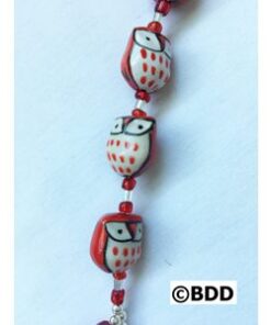 Three owl beads on red bracelet