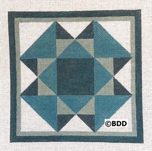 A blue and white quilt block on a canvas.