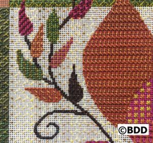 A cross stitch pattern of an autumn leaf.