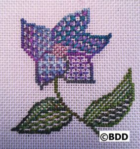 Purple clematis cross stitch with green leaves
