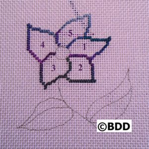 A cross stitch pattern of a flower with four petals.