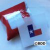 A red bag and a white paper with the texas flag on it.