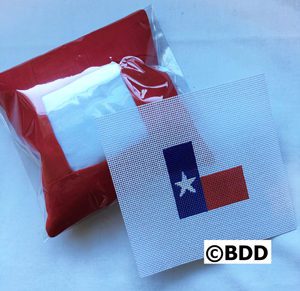 A red bag and a white paper with the texas flag on it.