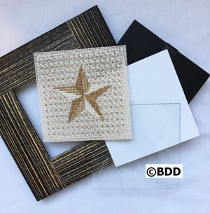 A star is stitched on the back of a picture frame.