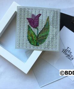 A white box with a purple flower on it