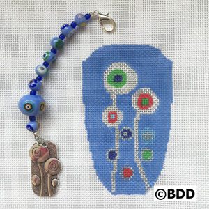 A blue bead and a piece of art