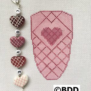 Embroidered pink heart with "love" charm.