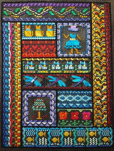 A colorful quilt with a woman in the center.