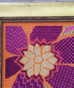 A cross stitch pattern of an orange and purple flower.
