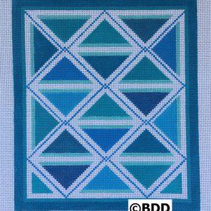 A blue and white quilt with a border.