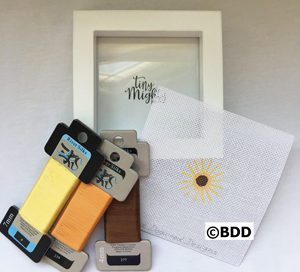 A white picture frame with some cell phone cases