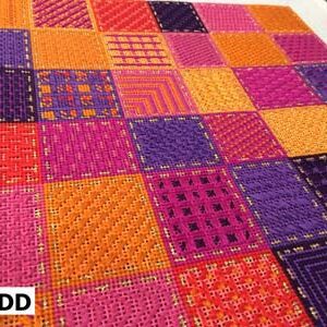 A colorful rug with many different colors of fabric.