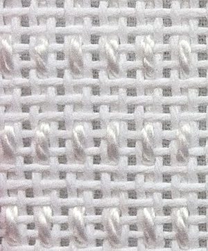 A close up of the fabric on a white background