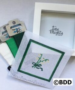 A picture frame with some green and white designs on it
