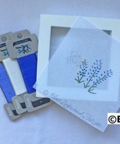 A box of blue ribbon and some white paper