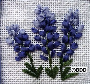 A group of blue flowers on a white background.