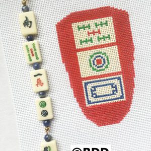 A red and white swatch with beads on it