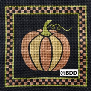 A pumpkin with a checkered border on it.