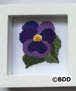 A cross stitch picture of a purple flower.