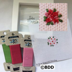 A picture frame with some ribbon and other items