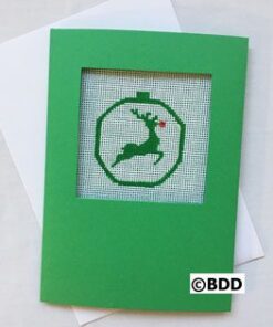 A green card with a picture of a reindeer in the middle.