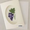 A card with purple grapes on it.