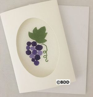 A card with purple grapes on it.