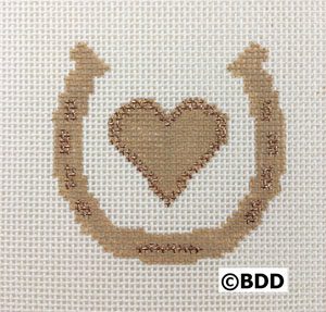 A cross stitch pattern of a horseshoe with a heart.