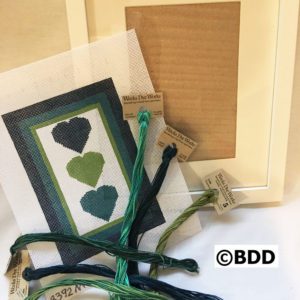 A green heart card and some string