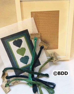 A green heart card and some string