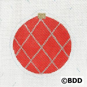 A red ornament with silver trim on it.