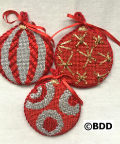 Three christmas ornaments made from red and white fabric.