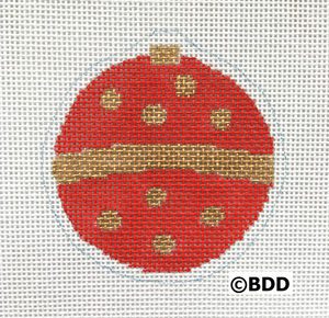 A red and gold ornament with dots on it.