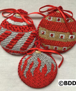 Three red and silver ornaments with a ribbon.