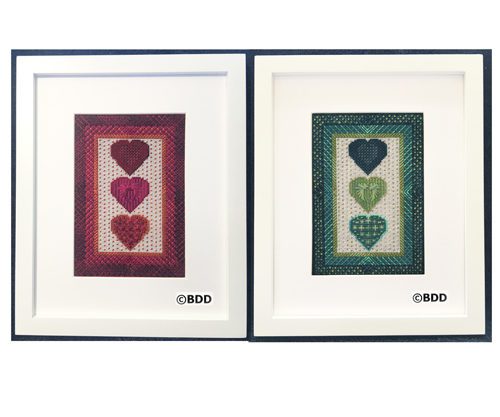 Two framed pictures of hearts in a row.