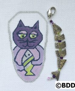 A cat with a candle in it's mouth and a key chain.