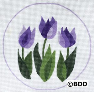 A purple flower is in the middle of a circle.