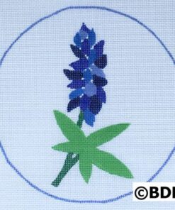 A blue flower sitting in the middle of a circle.