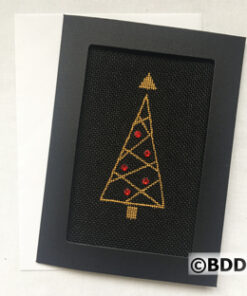 A black framed picture with a gold and red tree.