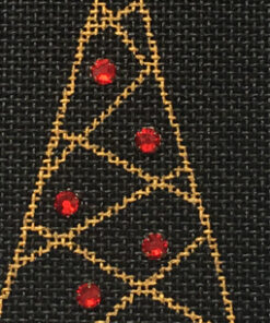 A black fabric with red and gold triangles on it