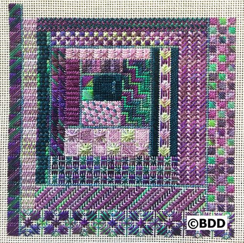 A square of purple and green fabric with some designs on it