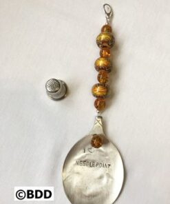 A spoon with the words " applelassip " written on it.