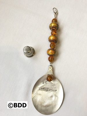 A spoon with the words " applelassip " written on it.