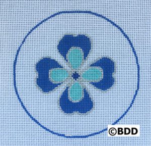 A blue and white flower in the center of a circle.