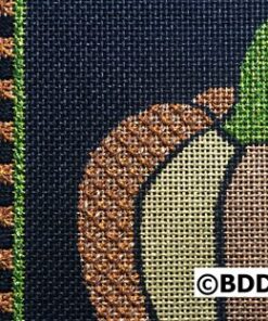 A close up of the pumpkin on the fabric.