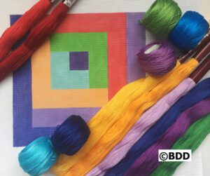 Colorful embroidery threads and canvas square design