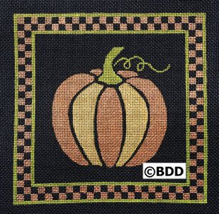 A pumpkin with a checkered border on it.